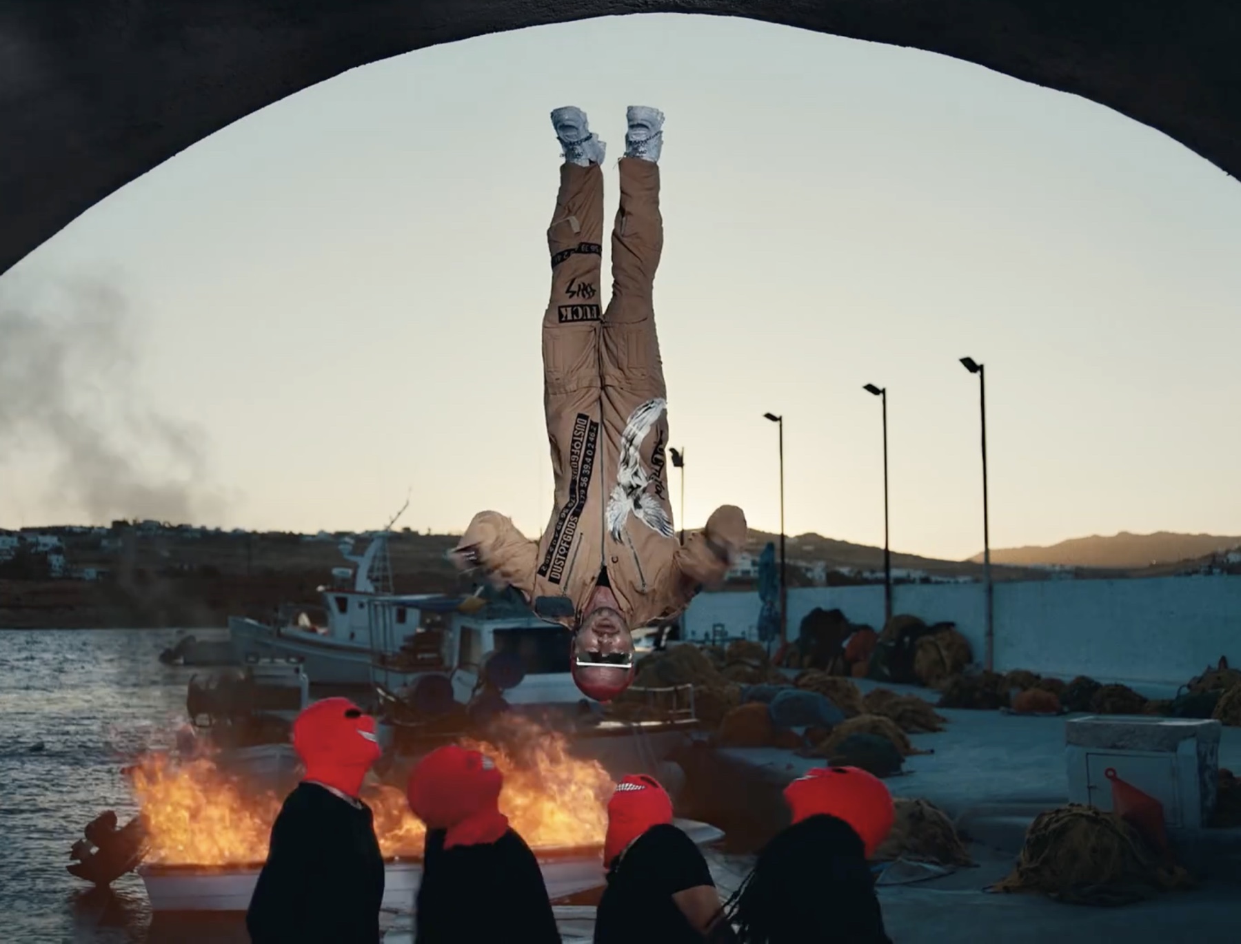 J Balvin upside down in Cuidao Por Ahí