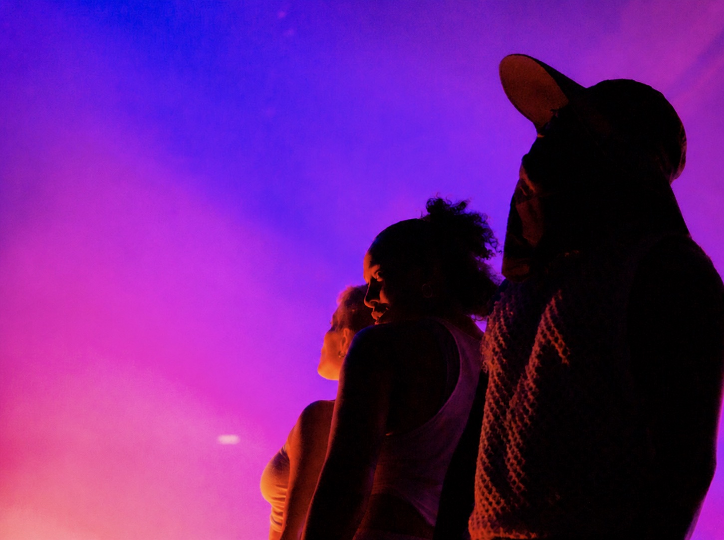 Röyksopp performers in magenta stage light